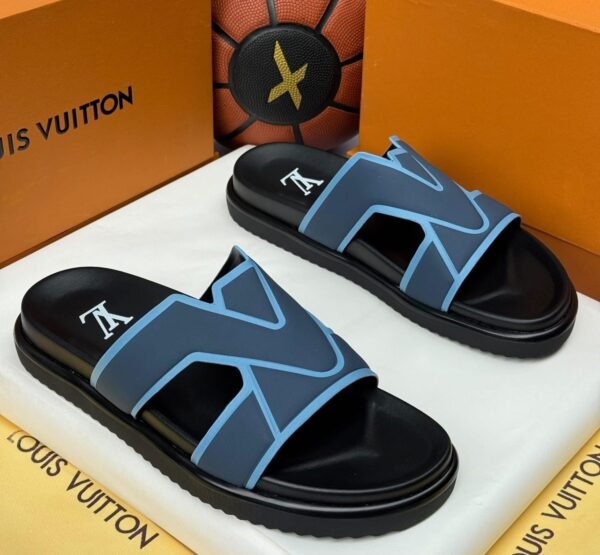 A pair of black and blue slide sandals with a Louis Vuitton-inspired design, placed in a luxury box with the Jsfootis branding.