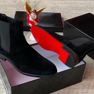 Brown suede Chelsea boots with elastic sides and black soles, presented in an open black box with red interior, Jsfootis